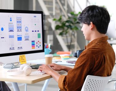 Website designer, Creative planning phone app development template layout framework wireframe design, User experience concept, Young asian man UX designer working on smartphone application at office